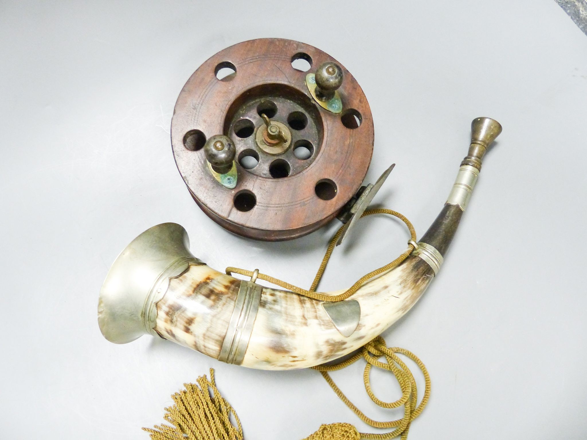 A 19th century Scottish plate-mounted hunting horn and an antique wooden fishing reel